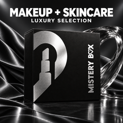 Mystery Box Makeup e Skincare Luxury Selection, scatola nera chiusa con stampa argento in una scenografia nera, grafite e argento; contenuto non mostrato.